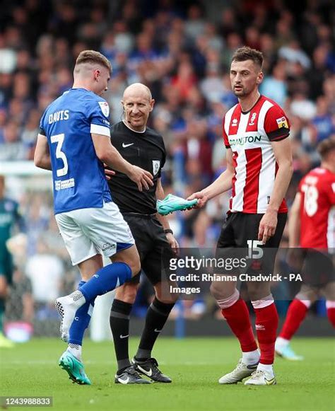 Ipswich Town's Leif Davis receives his boot from Lincoln City's... News ...