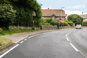 What does the solid white line at the side of the road indicate? - Theory Test