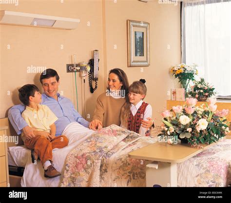 Family in hospital. Mother and children visiting Father in hospital Stock Photo, Royalty Free ...