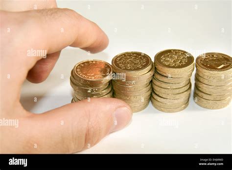 hand counting cash sterling pound coins Stock Photo - Alamy