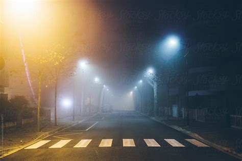 "Fog In The City At Night" by Stocksy Contributor "Vero." - Stocksy