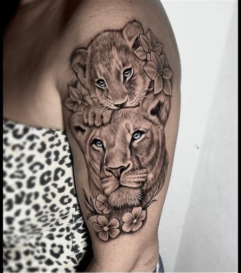 Stunning Lion and Flower Arm Tattoo