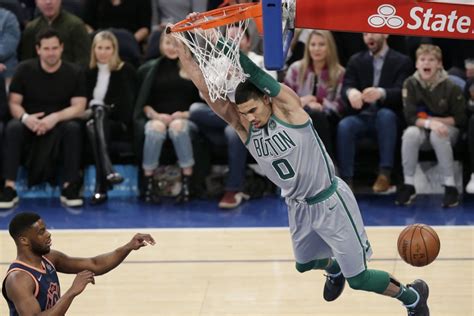 Watch: Celtics' Jayson Tatum jukes Joel Embiid, dunks on Ben Simmons on same play - UPI.com