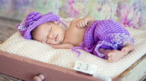 Cute Child Is Sleeping On White Bed Wearing Purple Woolen Knitted Cloth And Cap HD Cute ...