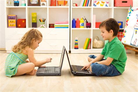 Kids playing computer games Stock Photo by ©ilona75 6430250