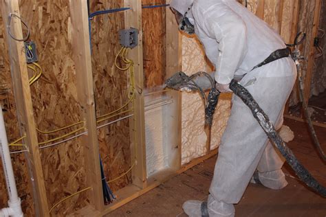 Foam Engineers Applies SPRAY FOAM INSULATION behind wiring | St. Louis MO Spray Foam Insulation