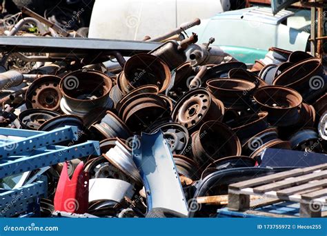 Pile of Old Rusted Car Rims Mixed with Various Other Car Parts Left in Local Scrap Yard for ...