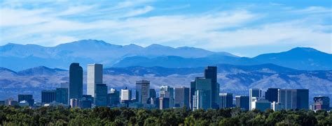 Denver Colorado Skyline Against the Rockies - JL Denver