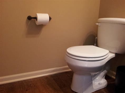 How to Install a Toilet Paper Holder in a Bathroom - Dengarden