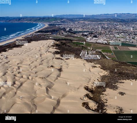 aerial above Pismo Beach dunes and the City of Oceano CA dunes Stock ...