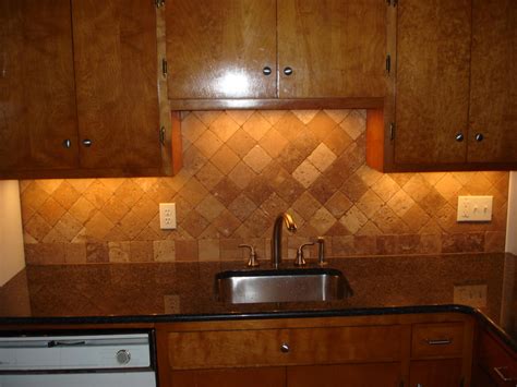 Tumbled travertine backsplash on diagonal layout first course straight ...