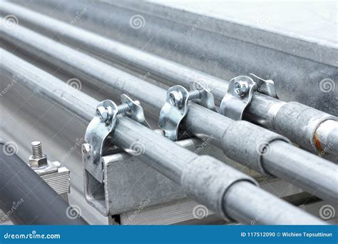 Electrical Conduit with Clamp Installation on Roof Stock Photo - Image ...