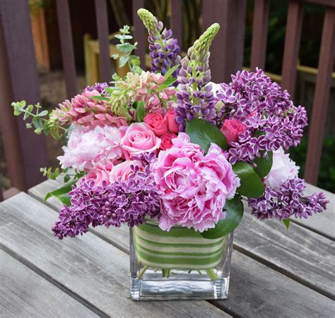 Flower arrangement with lilac, lupine, peonies, and roses. Peony Flower ...