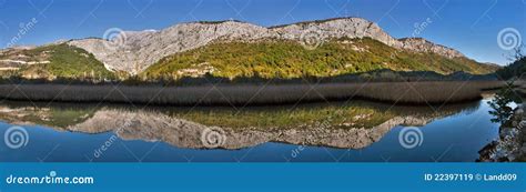 Reflection in the river 1 stock image. Image of lake - 22397119