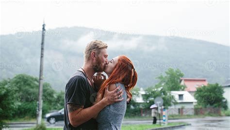 beautiful couple hugging in the rain 11488384 Stock Photo at Vecteezy