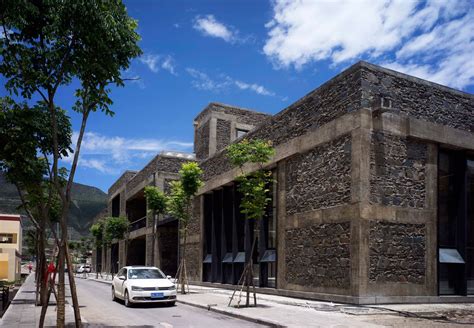 Tibetan school in China is clad is stone to match mountainous setting - Minimal Blogs