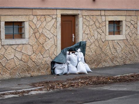 Sandbags As Flood Prevention in Front of a Door Stock Image - Image of ...