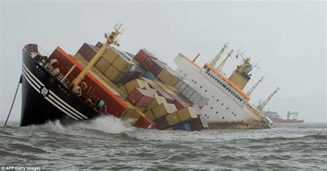 In pictures: Container ship collision sends 2 tons of oil pouring into the Arabian sea every ...