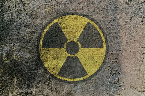 Radiation hazard warning sign depicted on a concrete wall 6260439 Stock Photo at Vecteezy