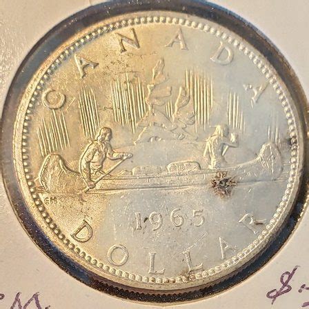 1965 Canadian Silver Dollar - Collectibles And More