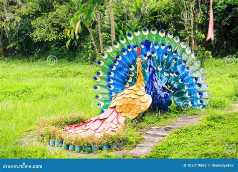 Sculptures of Peacocks on Grass by Stone Path in Park Stock Photo - Image of amusement, colorful ...