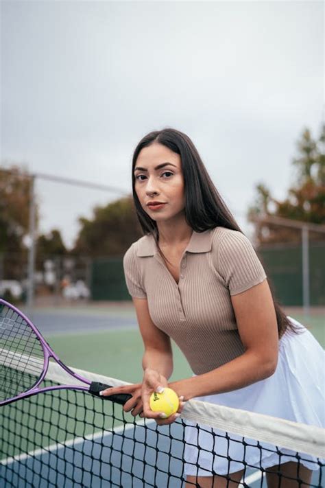 Portrait of a Woman on a Tennis Court · Free Stock Photo