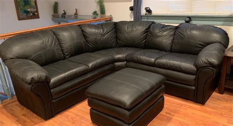 LOT 100: Black Faux Leather Sectional Sofa | EstateSales.org