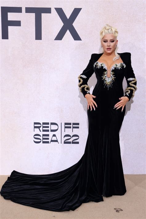 Christina Aguilera Dazzles With Glittery Snake Dress at amfAR x Cannes – Footwear News