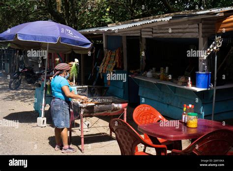 Santa Ana, El Salvador - January 29, 2022: Woman preparing street food ...