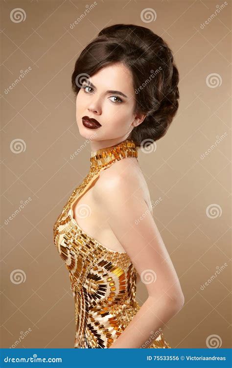 Beauty Makeup. Hairstyle. Fashion Woman in Gold Dress Stock Photo ...