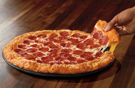Pizza Hut Debuts Grilled Cheese Stuffed Crusts, Extreme Cheese Pull Dreams Come True