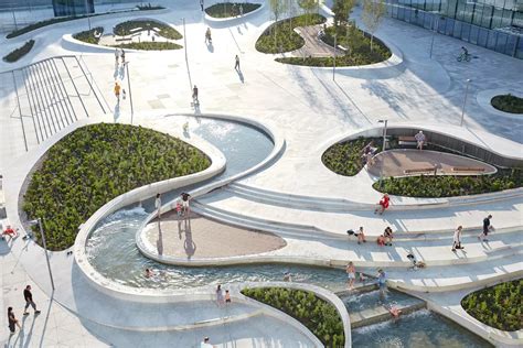 an aerial view of people walking and playing in the water at a public ...