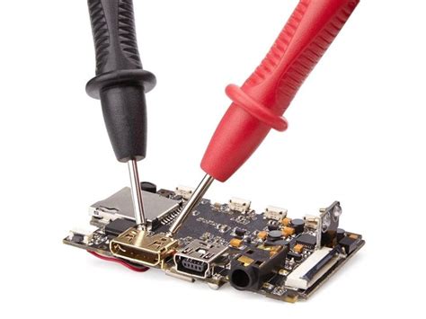 a screwdriver is being used to remove the motherboard from its socket