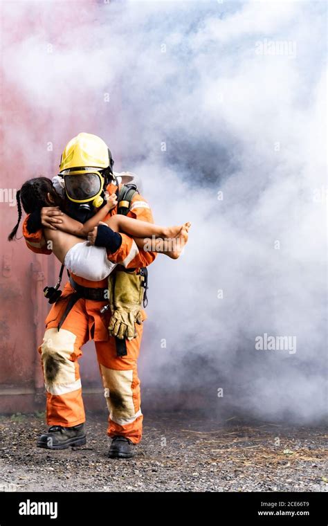 Firefighter rescue victim hi-res stock photography and images - Alamy