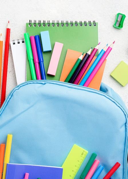 Free Photo | Flat lay of school essentials with backpack and pencils