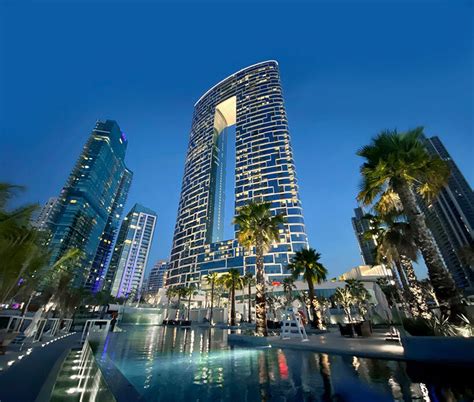 killa design tops 'address' beach resort towers with bridging infinity pool