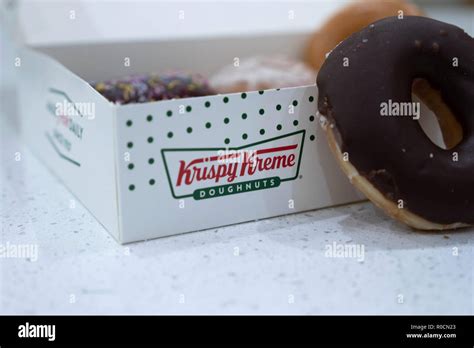 Krispy Kreme doughnuts in a box Stock Photo - Alamy