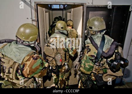 FBI SWAT (Special Weapons and Tactics) team members don specialized ...