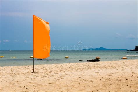 The Orange Flag on Beach, Sea Background Stock Photo - Image of flag, nature: 71811400