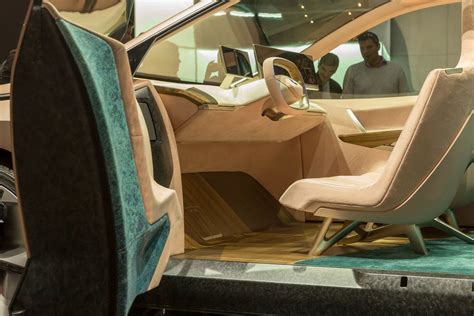 Comfortable Interior design, steering wheel and displays in the electric SUV BMW Vision iNext ...