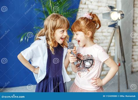 Two Happy Little Children Sing a Song in Karaoke. the Concept is Stock Photo - Image of duet ...