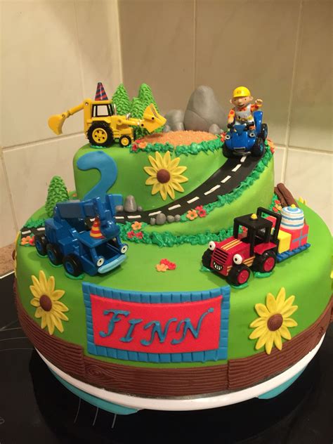 a birthday cake with a train and cars on it