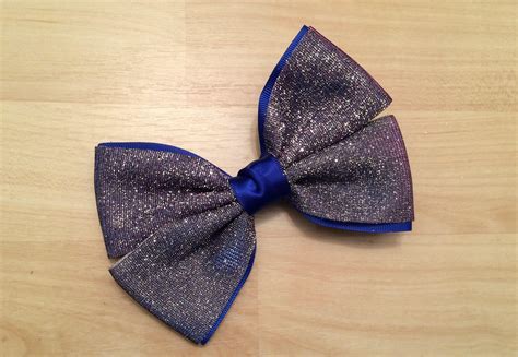 Introducing the blue party hair bow that sparkles with glitter ...