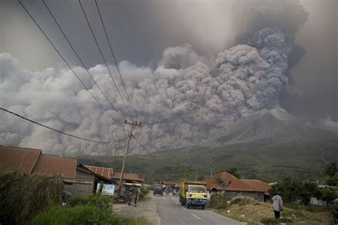 Chunk of Indonesia's Mount Sinabung blasted away as eruption leaves peak 'completely annihilated ...