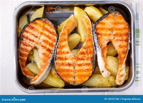 Grilled Salmon Steak with Potatoes Stock Photo - Image of fish, herb ...