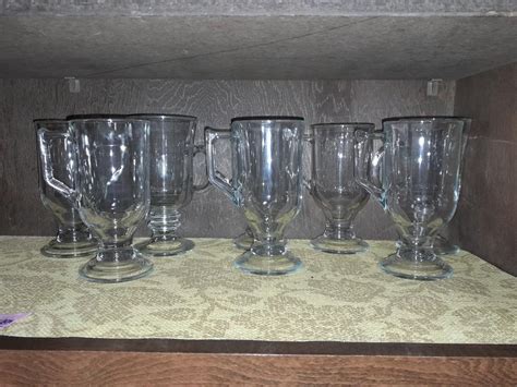 Eight clear glass drinking Glasses with handles | EstateSales.org