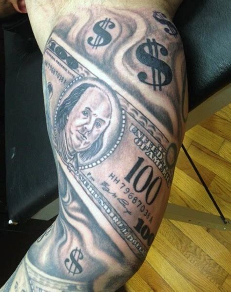 Amazing black and white dollar bills tattoo on biceps - Tattooimages.biz