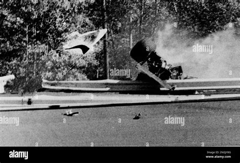 Francois Cevert's car rolls along the guard rail during practice for ...