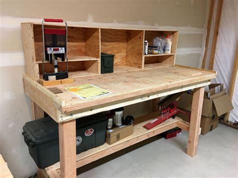 an unfinished workbench with tools on it