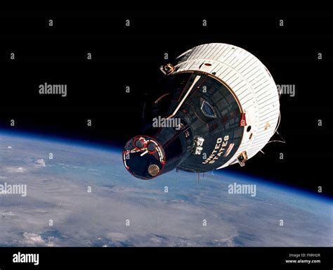 The Gemini 6 space capsule in Earth Orbit viewed by astronauts Wally Stock Photo, Royalty Free ...